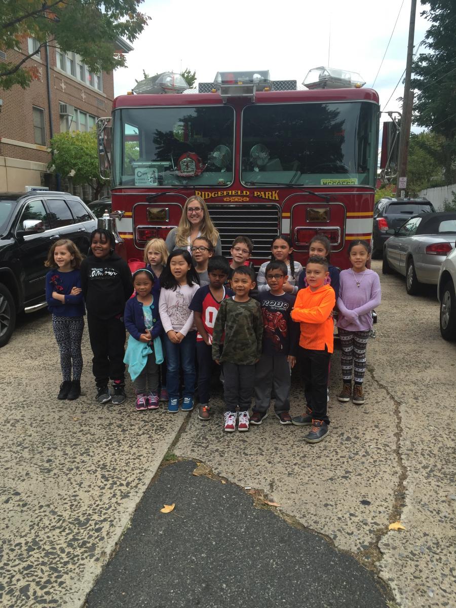 Children and Teacher in Front of Fire Truck