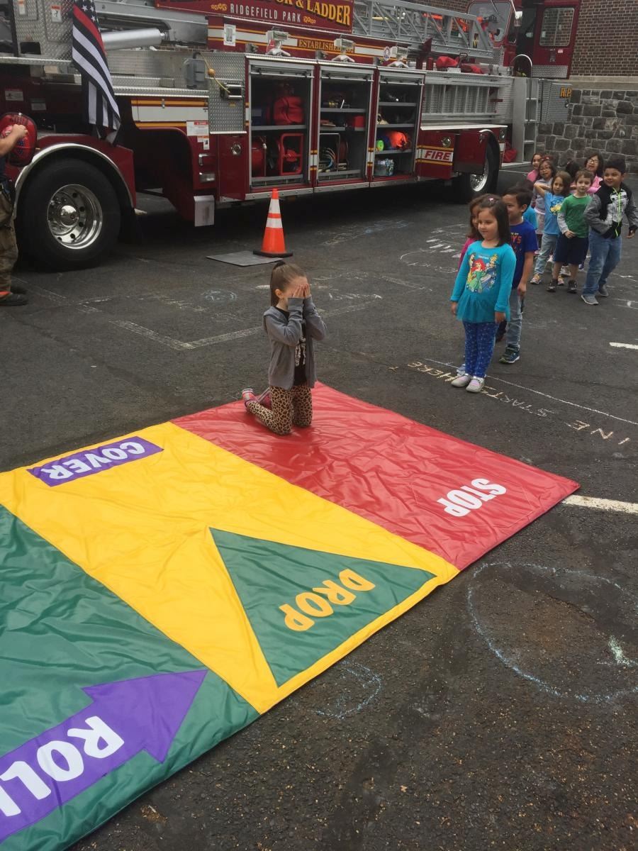 Children Practicing Stop Drop and Roll 4