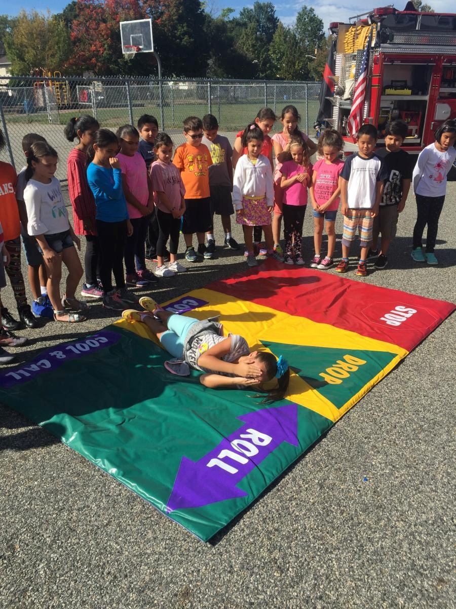 Children Practicing Stop Drop and Roll