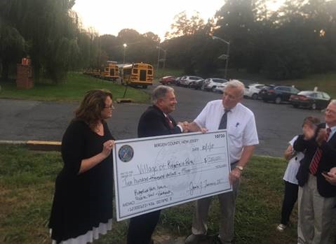 Bergen County Executive Jim Tedesco and Bergen County Freeholder Tracy Zur present Ridgefield Park Mayor George Fosdick with ceremonial check
