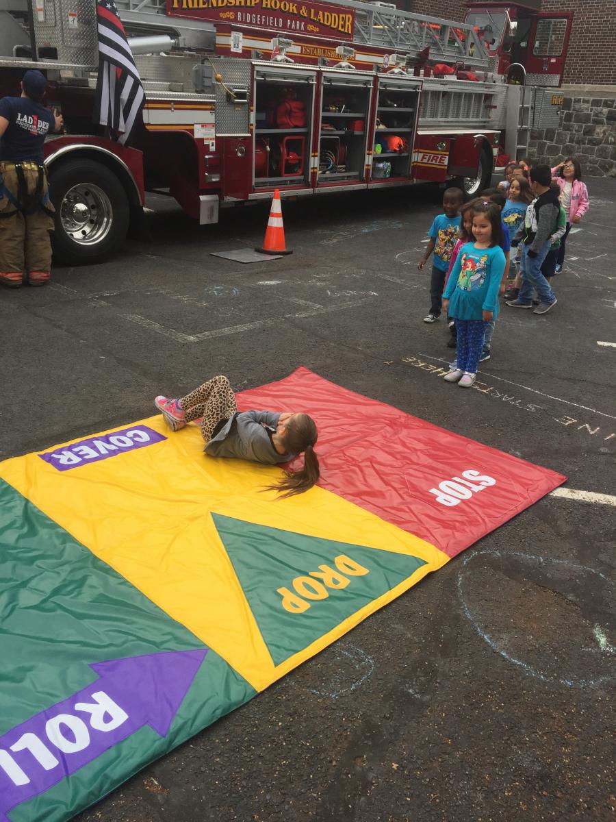 Children Practicing Stop Drop and Roll