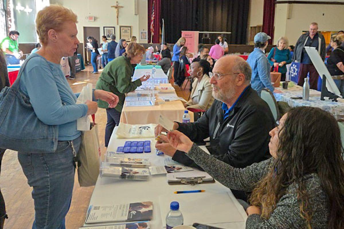 Residents visit with vendors at this year's Health Fair - Image