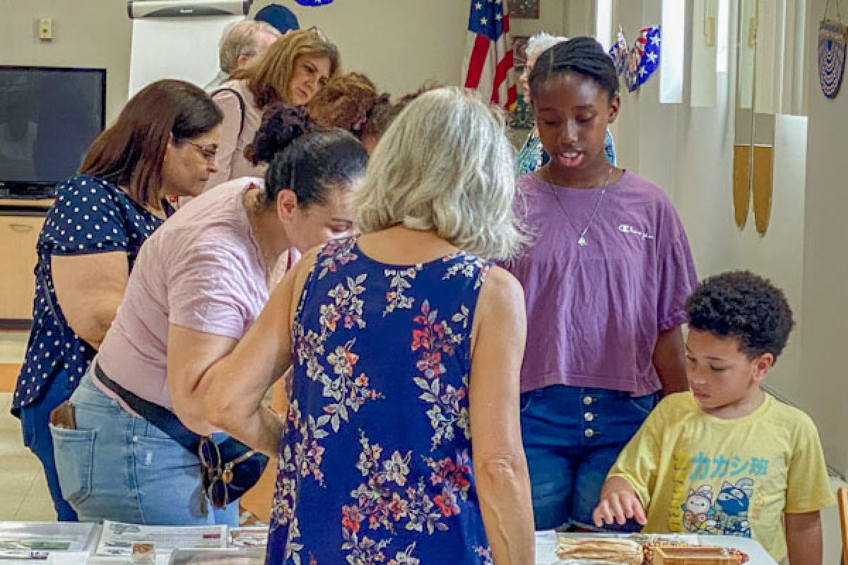 Participants view artifacts that are on display